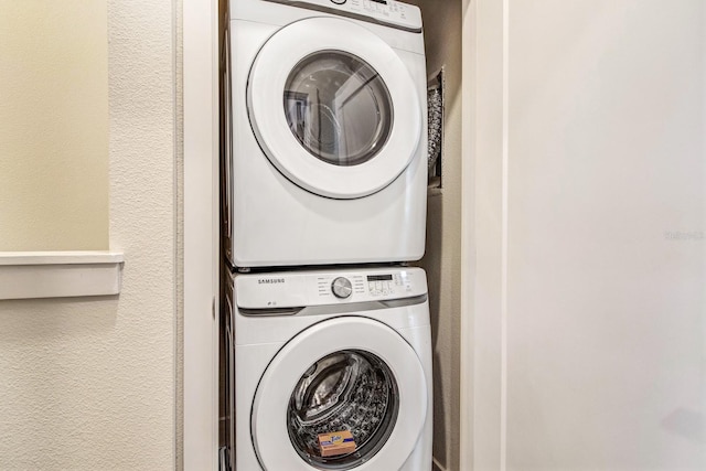 laundry area with stacked washer / drying machine