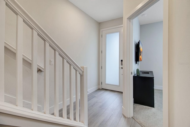 foyer entrance with light wood-type flooring