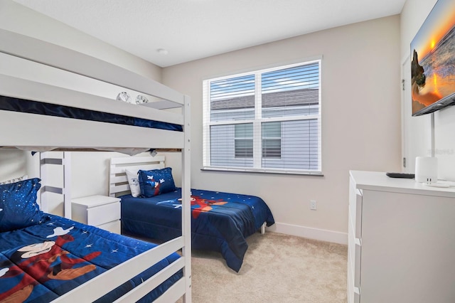 bedroom with light carpet