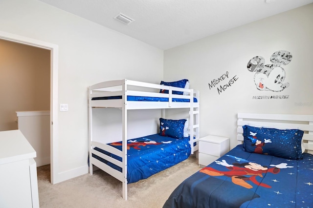 bedroom featuring light colored carpet