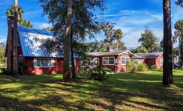 ranch-style home with a front lawn