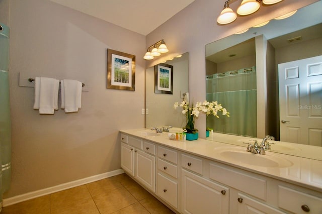 bathroom with tile patterned floors, vanity, and a shower with curtain