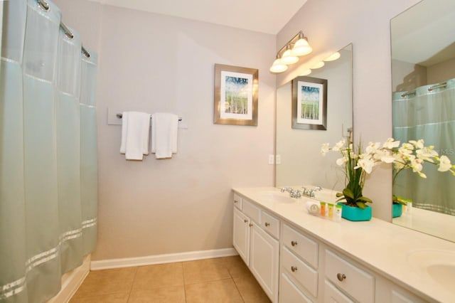 bathroom featuring tile patterned flooring and vanity