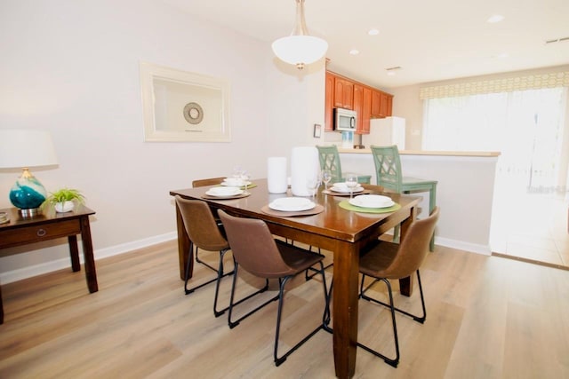 dining area featuring light hardwood / wood-style floors