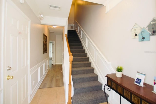 stairs with tile patterned floors