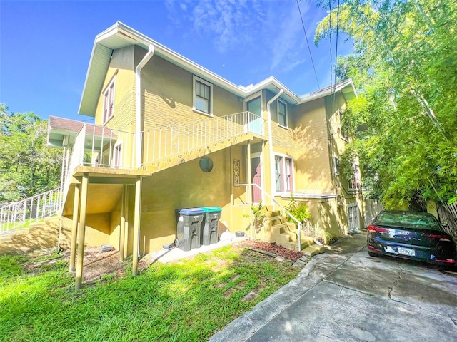 rear view of house with a balcony