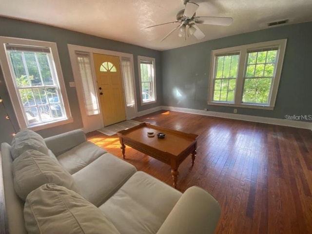 living room with ceiling fan and light wood-type flooring