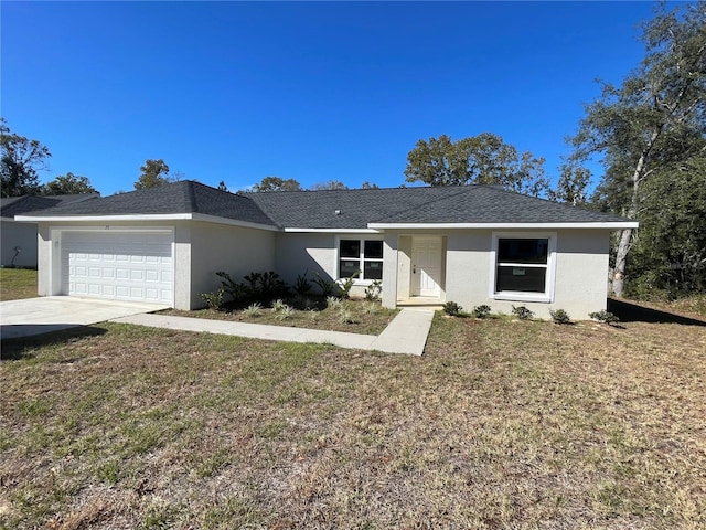 ranch-style home with a garage and a front yard