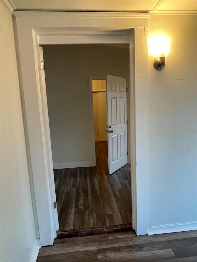 hall with dark hardwood / wood-style floors