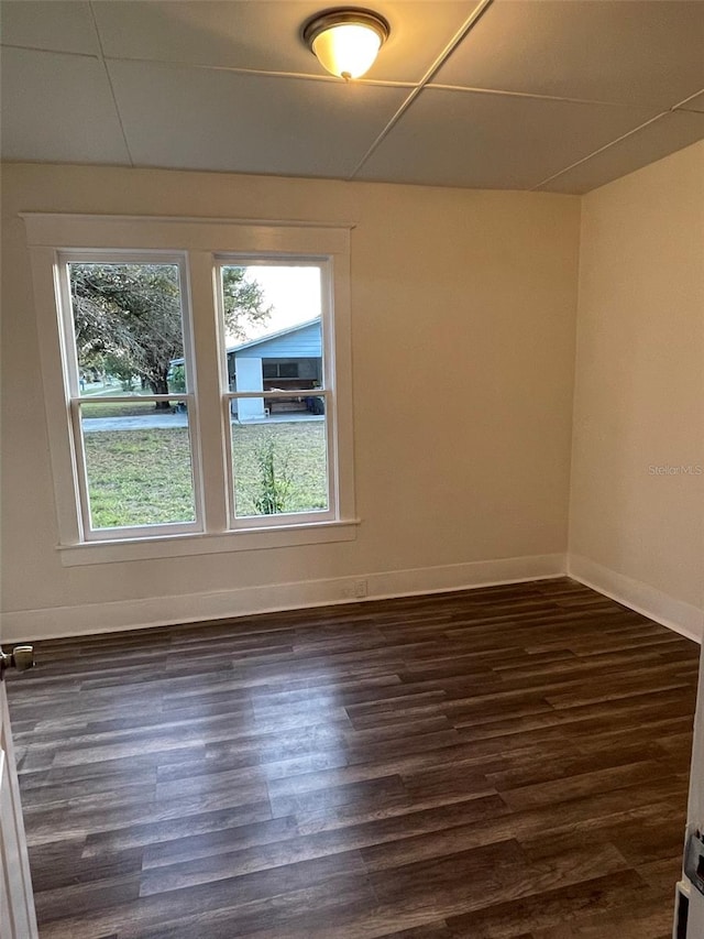 spare room with dark hardwood / wood-style flooring