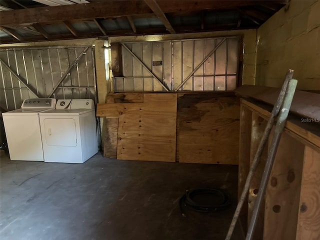 view of horse barn featuring washing machine and clothes dryer