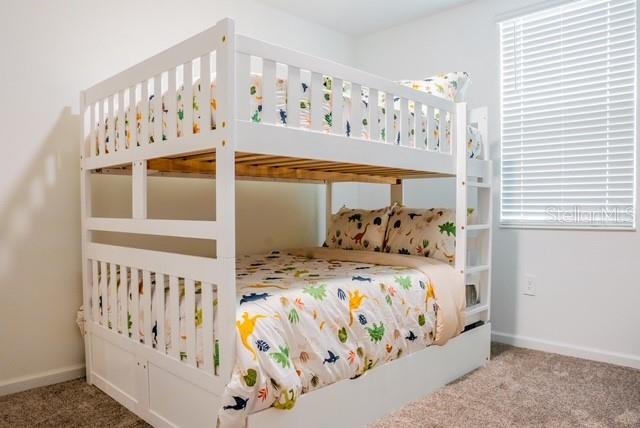 bedroom with light colored carpet