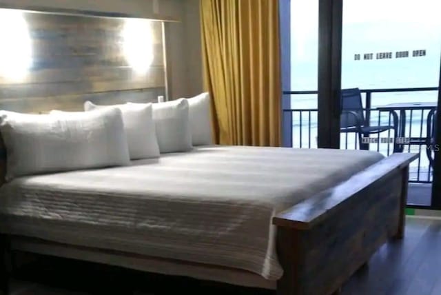 bedroom featuring dark hardwood / wood-style flooring