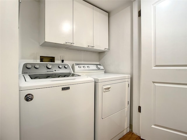 1513 Ocean Shore Blvd Unit 9E, Ormond Beach, FL 32176 - clothes washing area with cabinet space and washer and clothes dryer