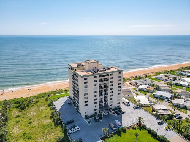 1513 Ocean Shore Blvd Unit 9E, Ormond Beach, FL 32176 - drone / aerial view featuring a beach view and a water view