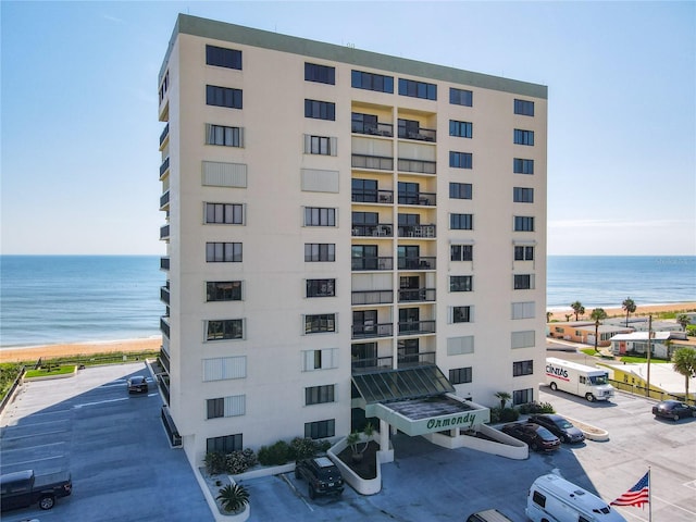 1513 Ocean Shore Blvd Unit 9E, Ormond Beach, FL 32176 - view of building exterior featuring a water view