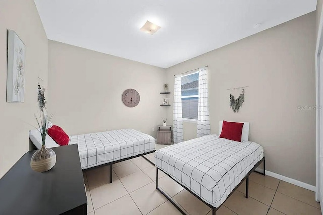 bedroom featuring light tile patterned flooring