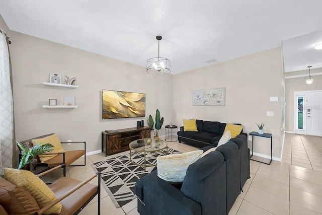 tiled living room with an inviting chandelier