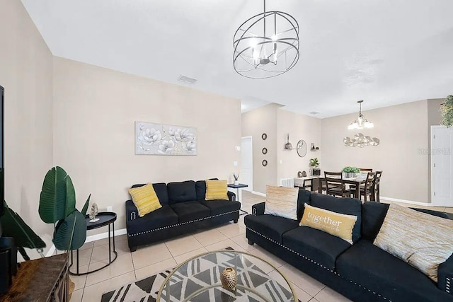 tiled living room featuring a notable chandelier