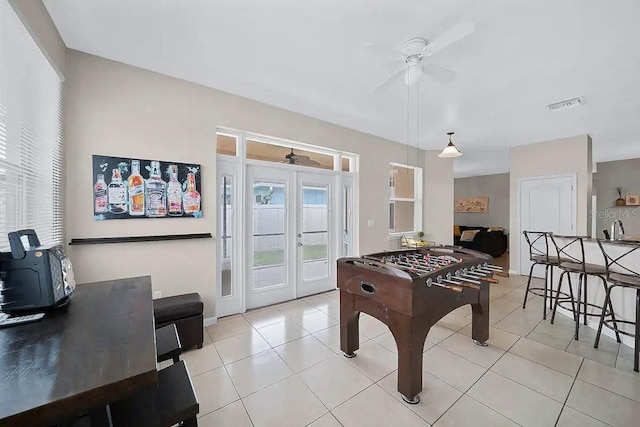 playroom featuring ceiling fan, light tile patterned floors, and sink