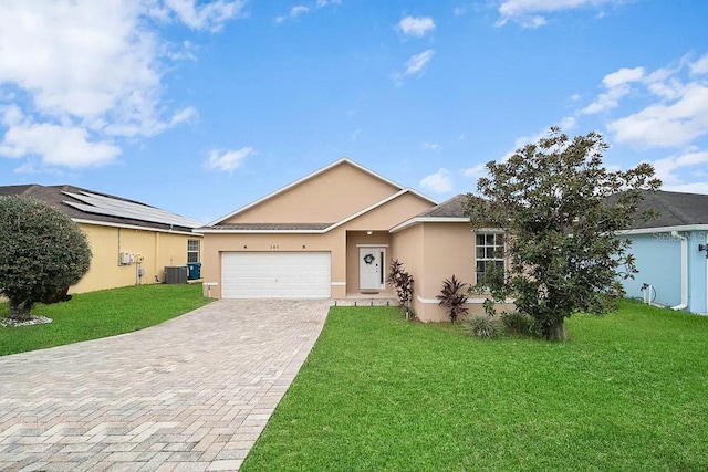 ranch-style home featuring a front yard, a garage, and central air condition unit