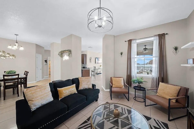 living room featuring light tile patterned floors and an inviting chandelier