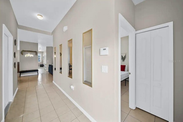 hallway with light tile patterned floors