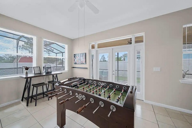 recreation room featuring ceiling fan and light tile patterned floors