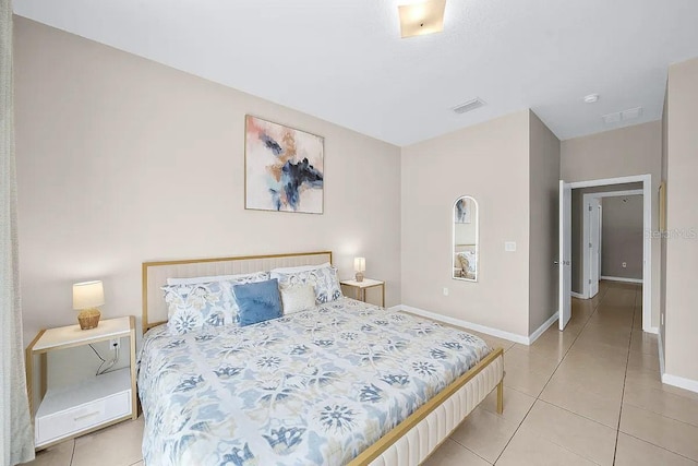 bedroom featuring light tile patterned floors