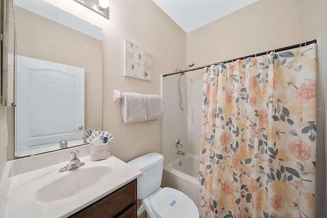 full bathroom with toilet, vanity, and shower / bathtub combination with curtain