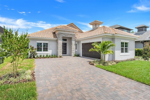 mediterranean / spanish-style home with a garage