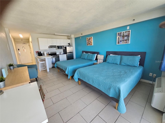 bedroom with stainless steel refrigerator, a textured ceiling, and light tile floors