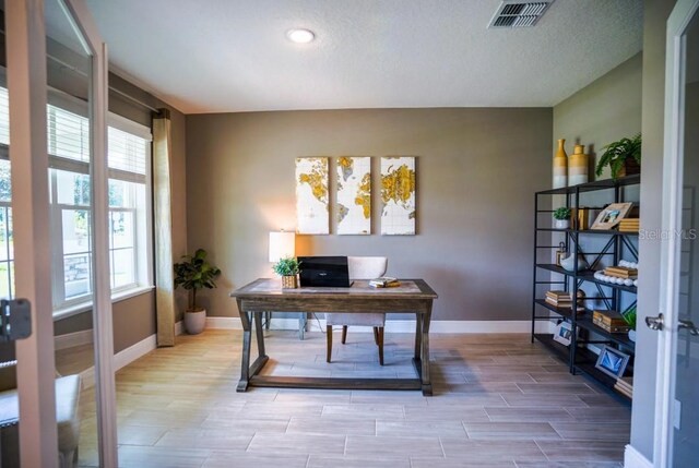 home office with a textured ceiling