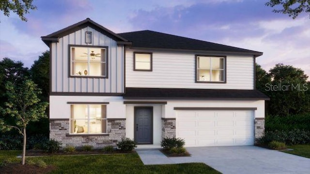 view of front of property with stone siding, board and batten siding, concrete driveway, and a garage