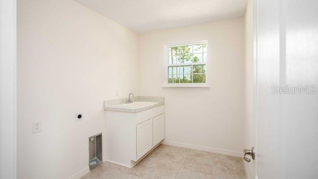 bathroom featuring baseboards and vanity