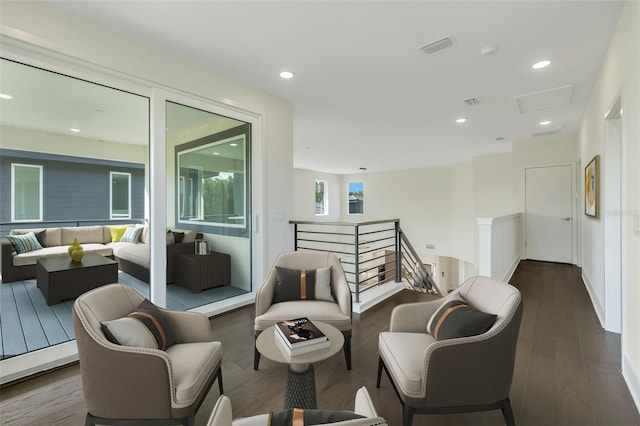 sitting room featuring dark hardwood / wood-style floors