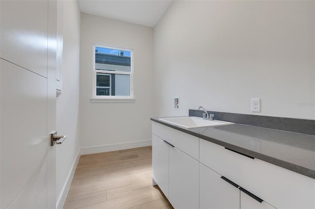 bathroom with vanity and hardwood / wood-style flooring