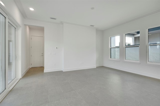 spare room featuring crown molding