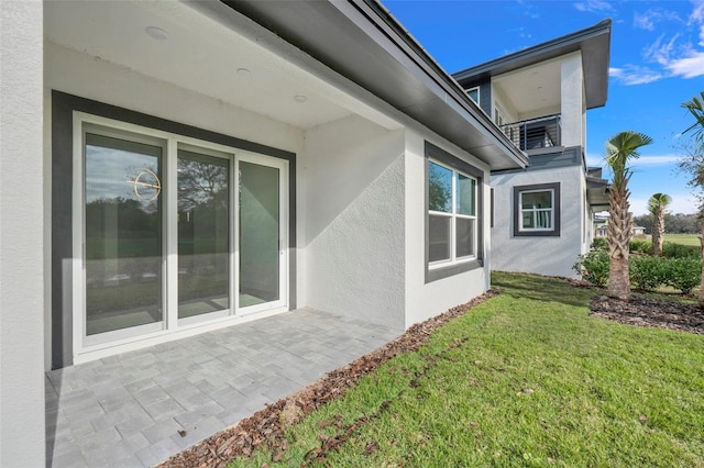 view of property exterior with a yard