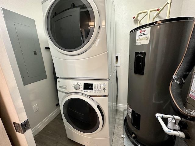 washroom with water heater, stacked washing maching and dryer, and dark wood-type flooring