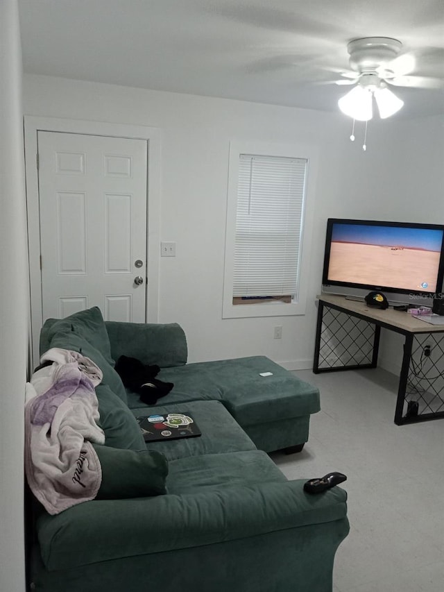 living room featuring ceiling fan