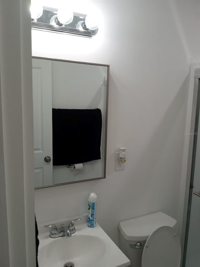 bathroom with sink and toilet