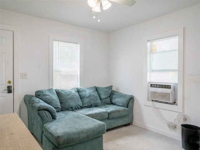 living room featuring ceiling fan and light tile floors