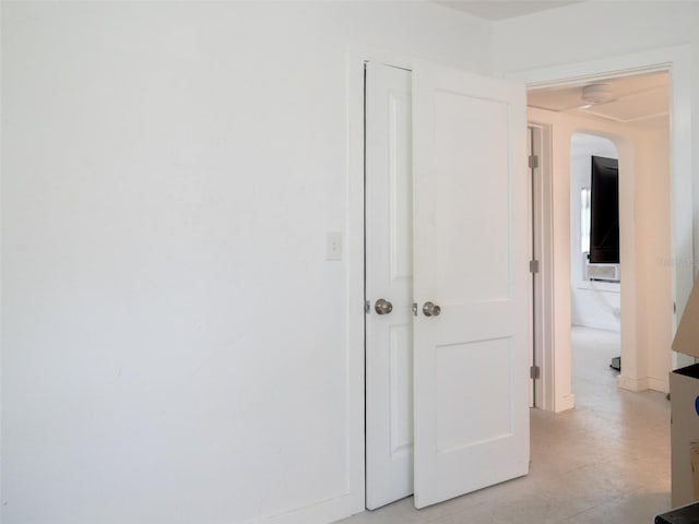 hall featuring light tile flooring