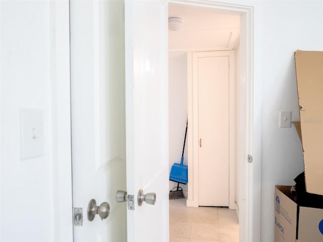 hall with light tile flooring