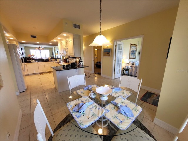 dining area with light tile floors