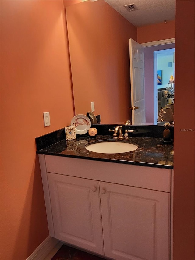 bathroom featuring oversized vanity