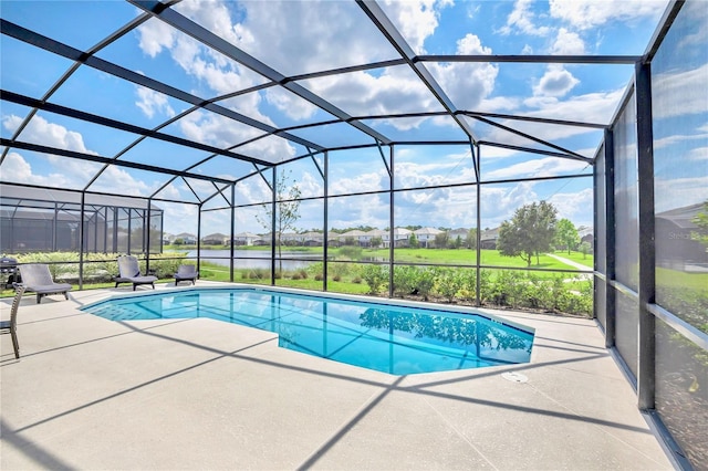 view of swimming pool with a patio and glass enclosure