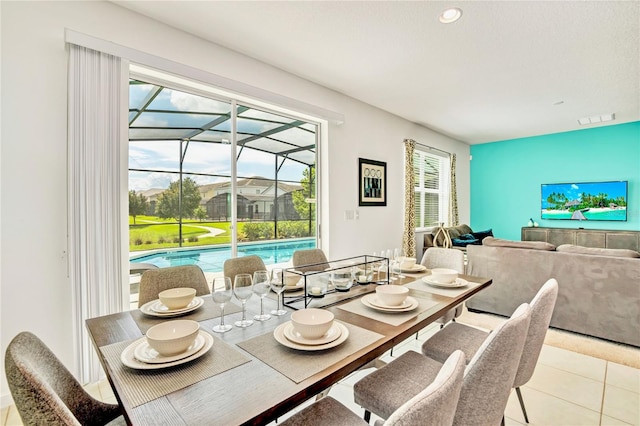 dining space featuring light tile floors and a wealth of natural light