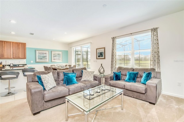 living room featuring light carpet